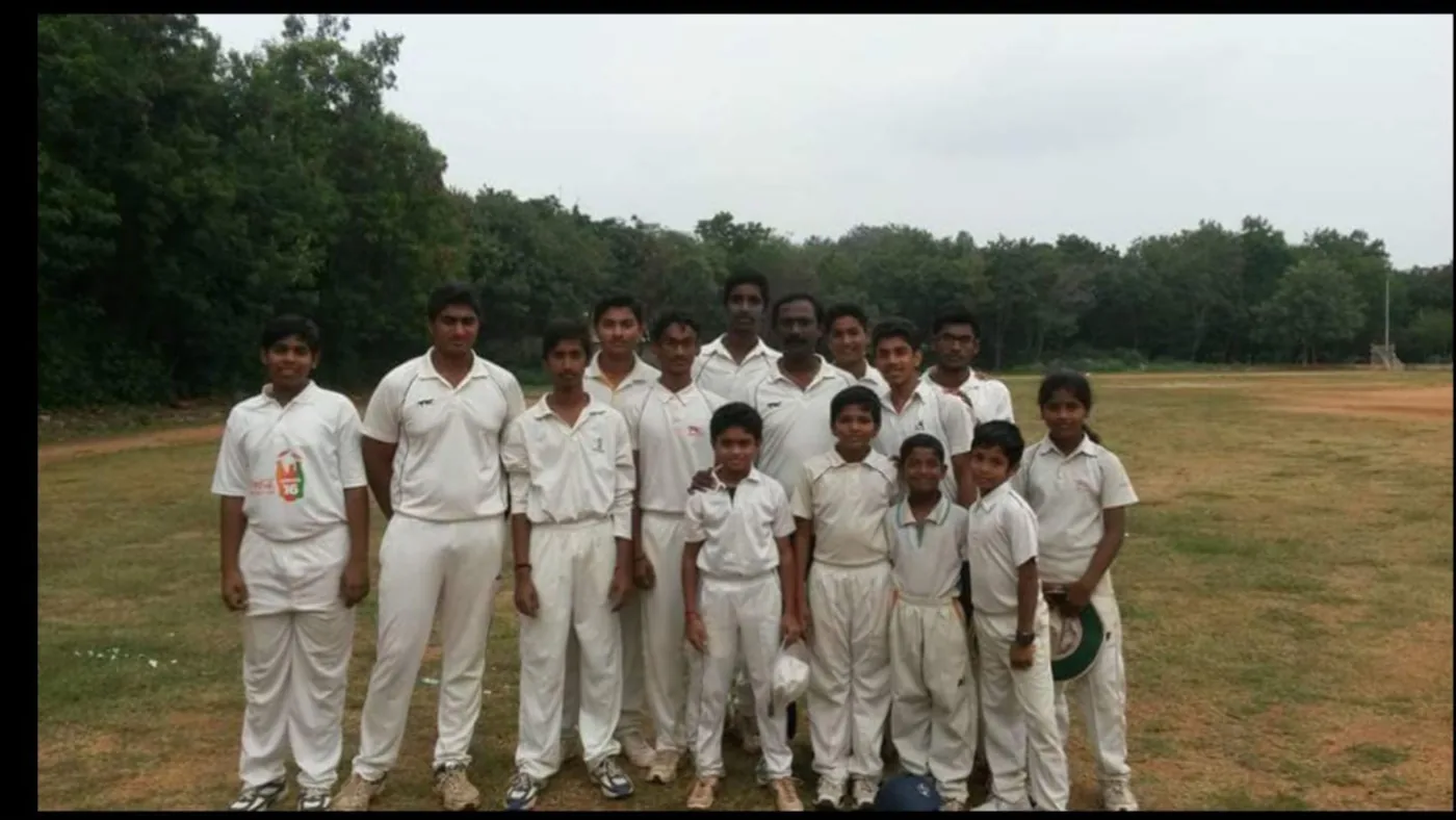 Cricket team standing together on the field