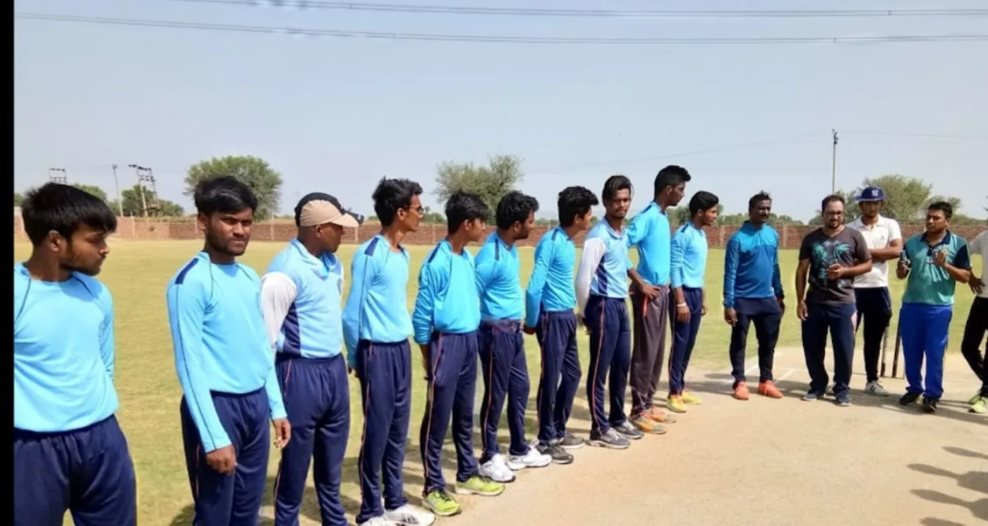 Academy students lined up in cricket uniforms