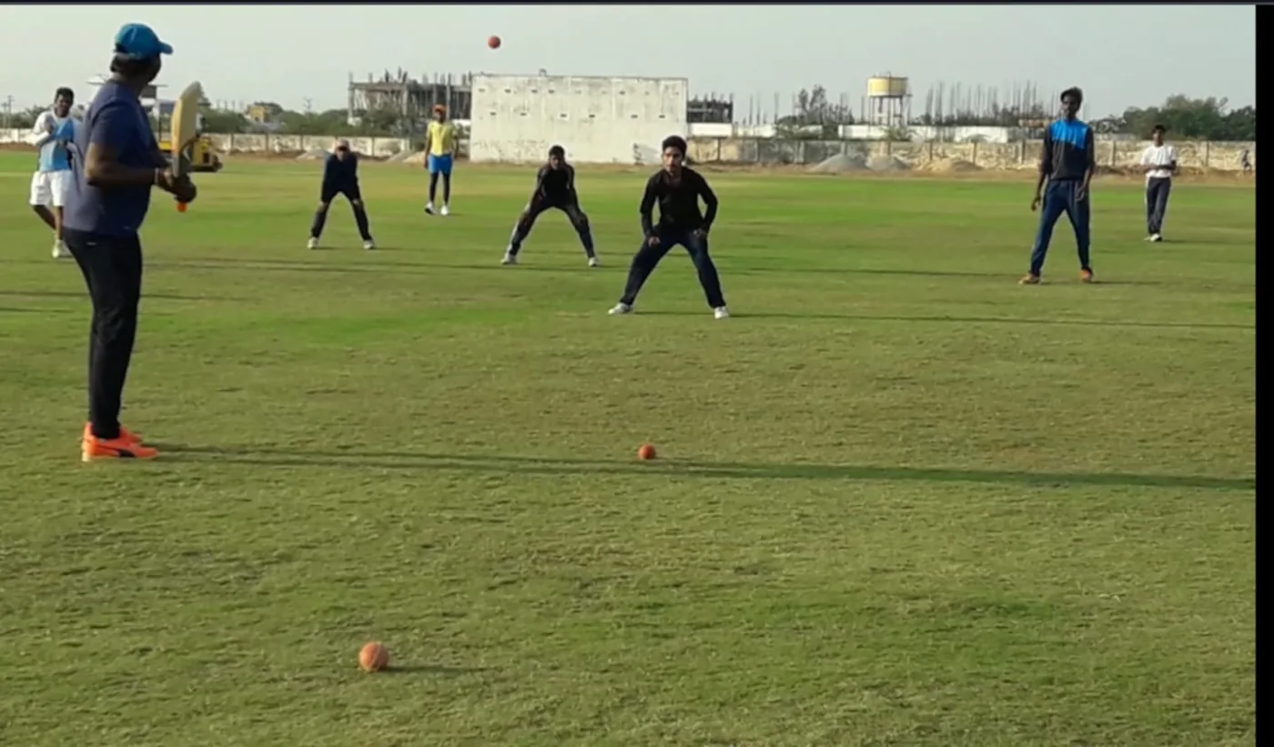 Players training on the cricket ground in Tirupati