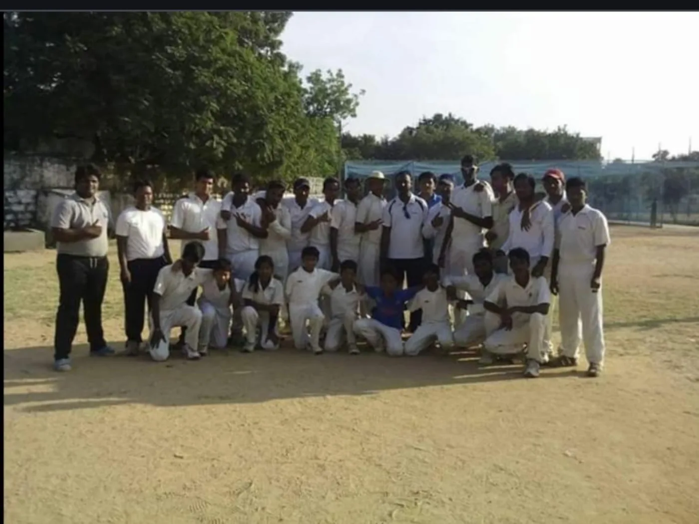 Team photo on cricket ground