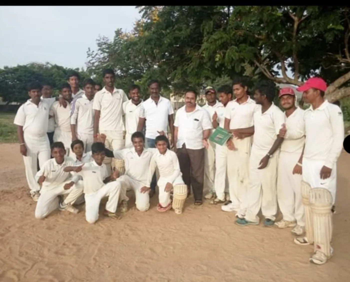 Cricket team in white uniforms